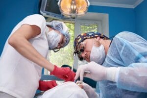 Doctors perform an operation in a dental clinic.